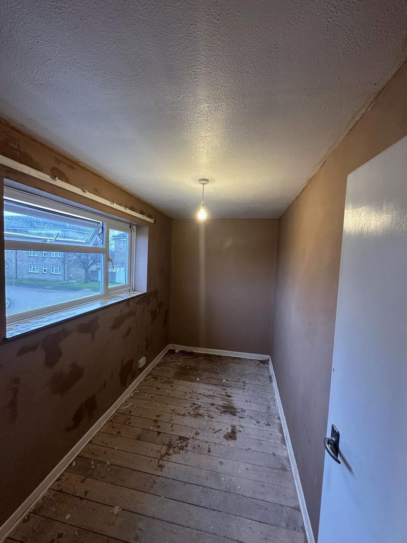The box room from the doorway end, walls skimmed